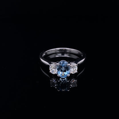 0.70ct Oval Aquamarine And Oval Diamond Three Stone Ring