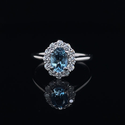 0.67ct Oval Aquamarine And Diamond Cluster Ring