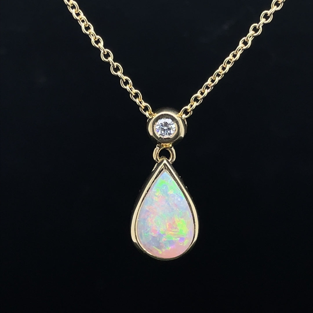 0.97ct Pear Cut Opal And Round Diamond Pendant