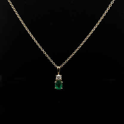 0.33ct Oval Emerald And Round Diamond Pendant