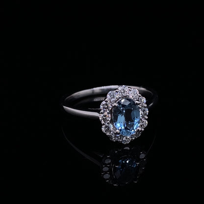0.67ct Oval Aquamarine And Diamond Cluster Ring